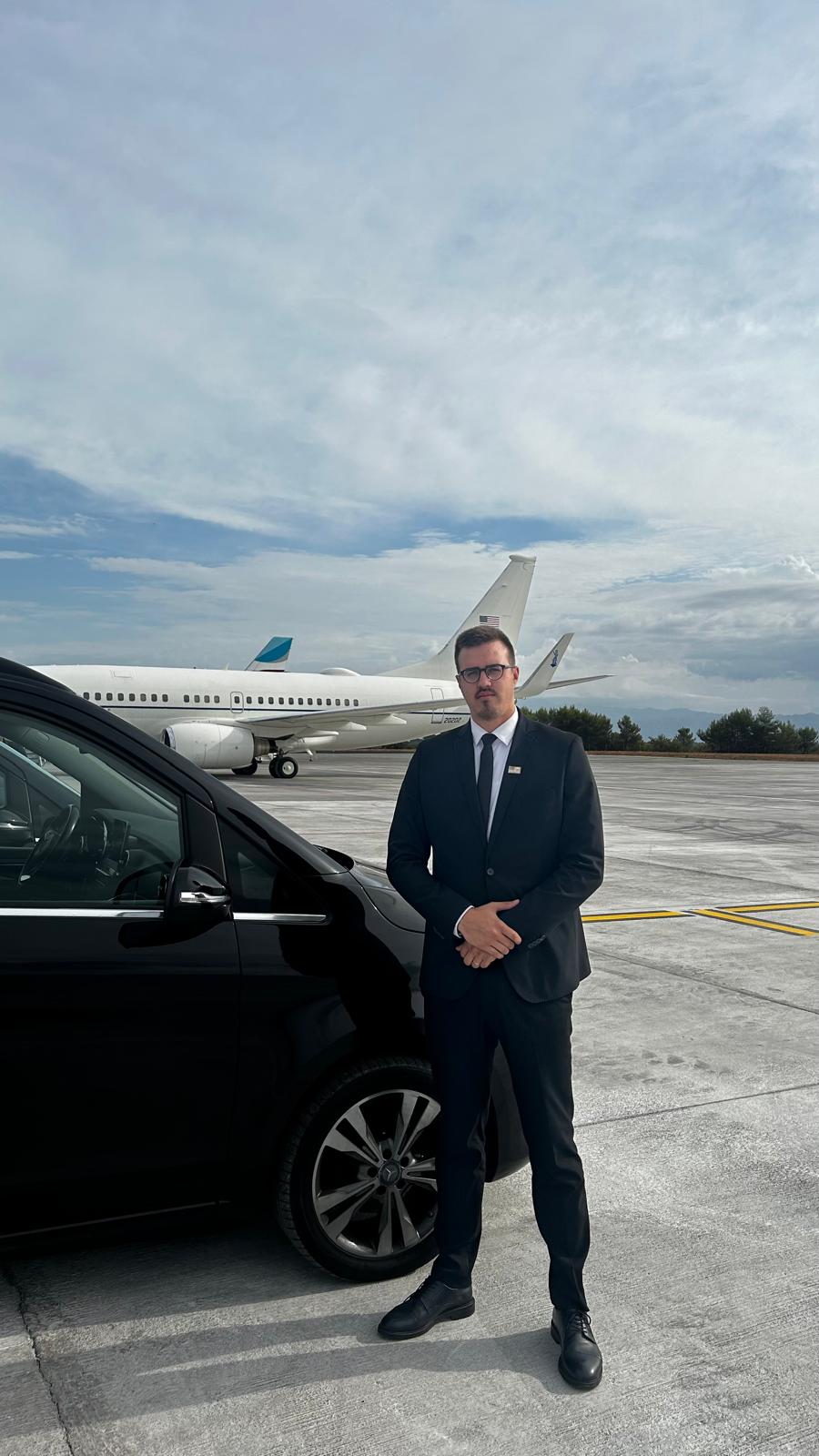 Marin, founder of MB Limo Zagreb, next to a black chauffeur van at the airport